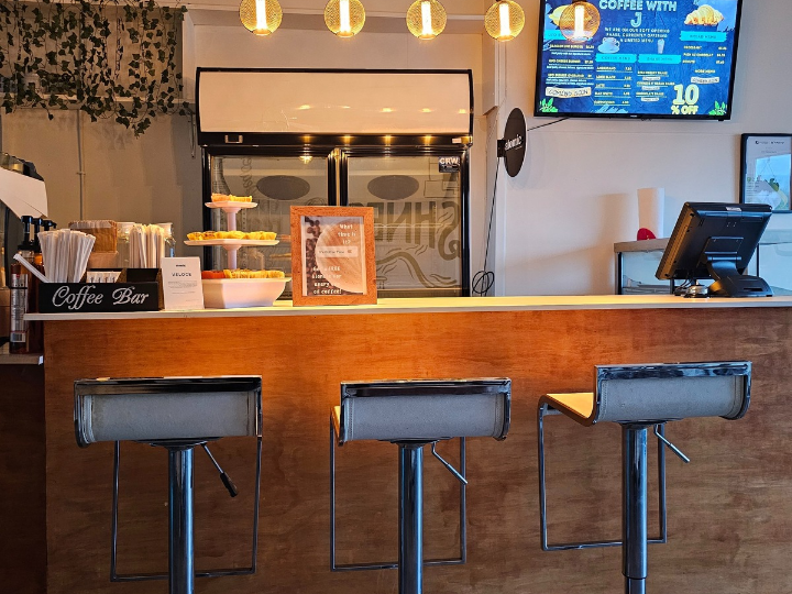 The counter and stools inside Coffee with J